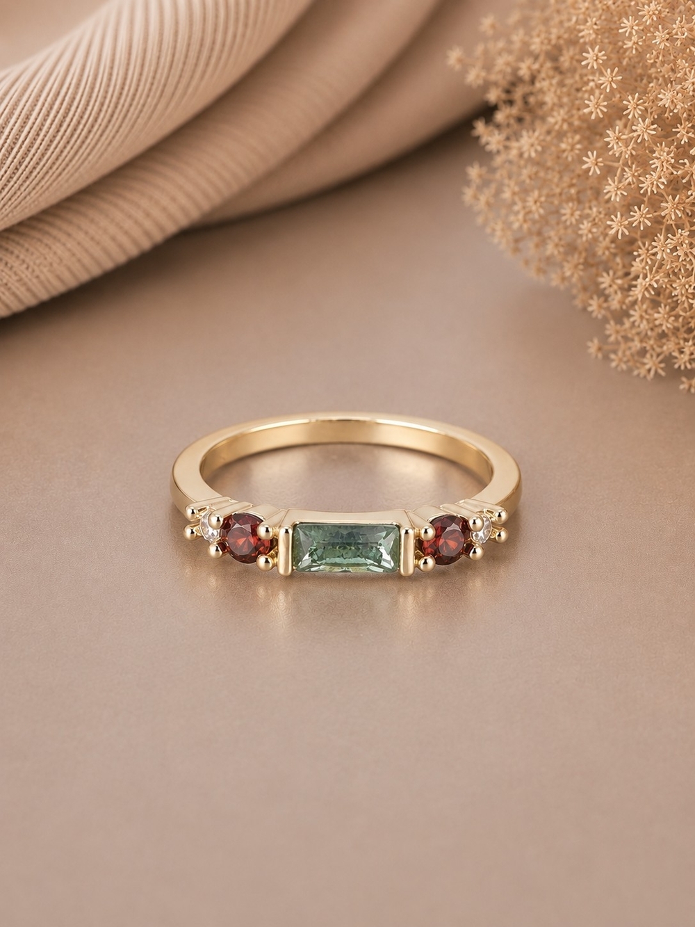 Gold Ring with Cloudy Blue Baguette Center Stone and Garnet Accents